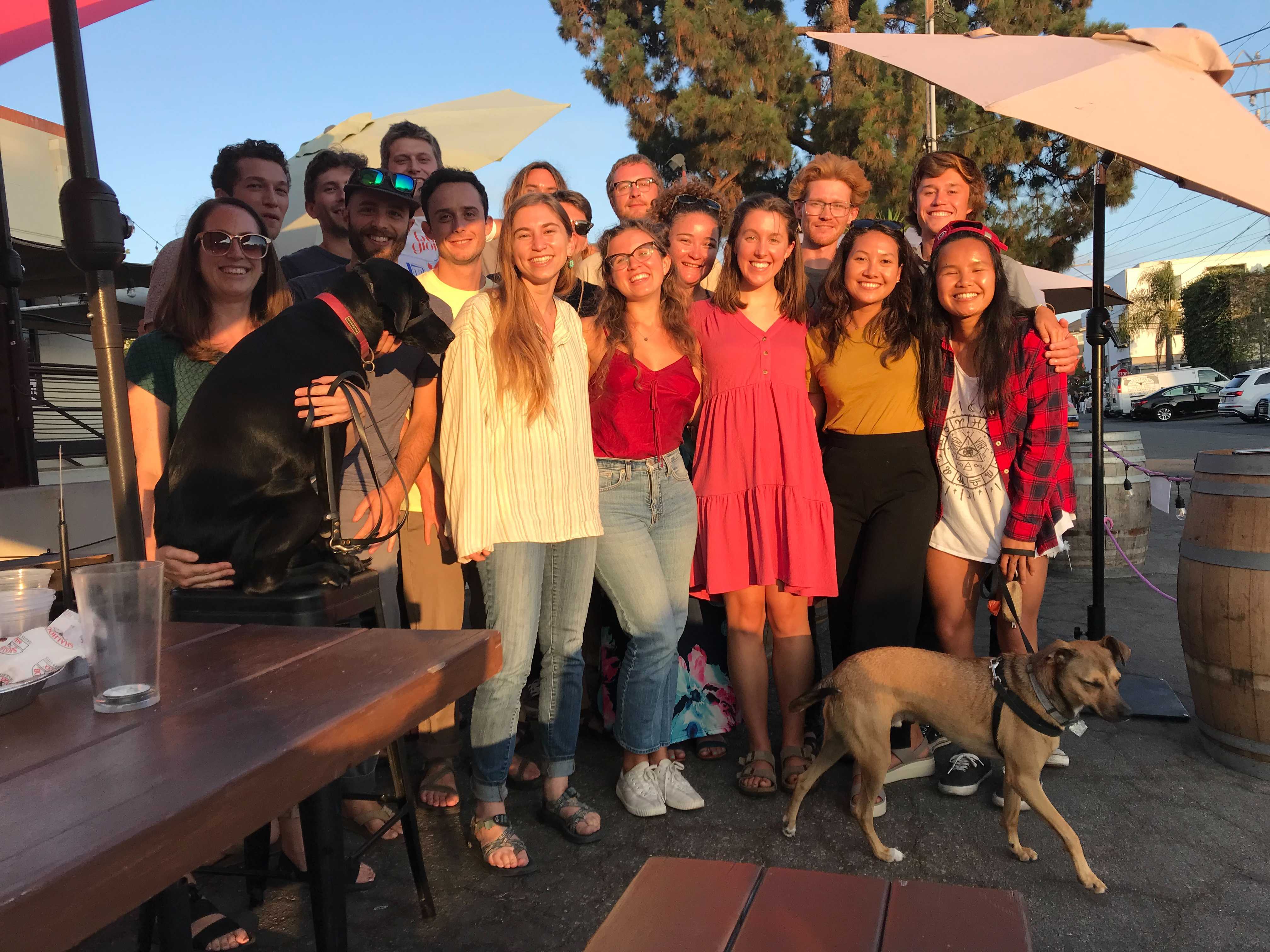 Members of the MEDS cohort in downtown Santa Barbara celebrating completing the first half of summer session classes with faculty and their pets.